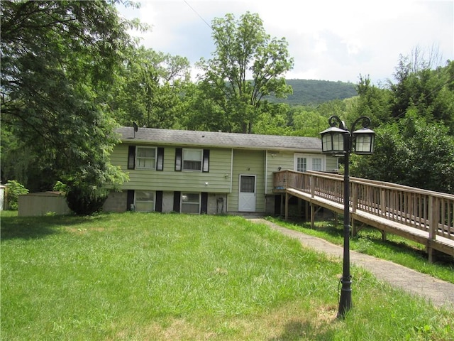 18 Mark Cir, Naples, NY 14512 - rear view of property featuring a deck and a yard