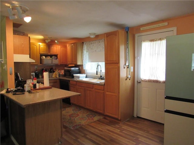 18 Mark Cir, Naples, NY 14512 - kitchen featuring freestanding refrigerator, range hood, light countertops, wood finished floors, and a peninsula