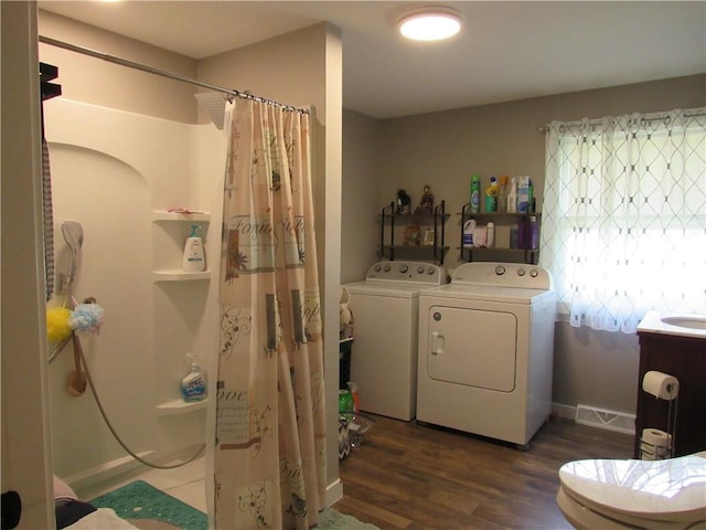 18 Mark Cir, Naples, NY 14512 - bathroom with washer and dryer, a shower with curtain, wood finished floors, and vanity