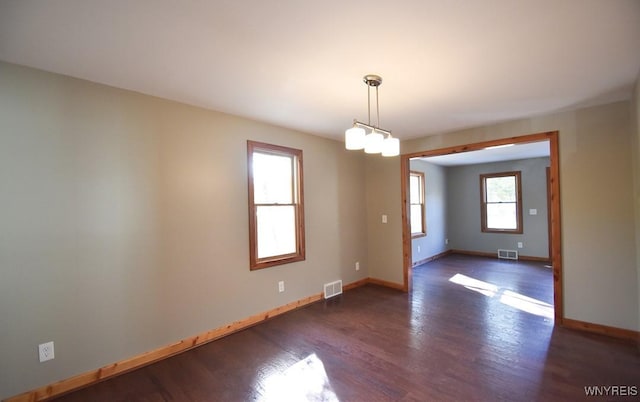 51 N Forest Rd, Amherst, NY 14221 - spare room featuring dark wood-style floors and a chandelier