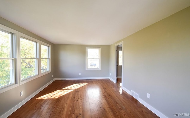 51 N Forest Rd, Amherst, NY 14221 - unfurnished room featuring plenty of natural light and dark wood-style floors