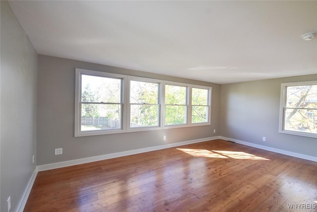 51 N Forest Rd, Amherst, NY 14221 - spare room with a smoke detector and wood finished floors