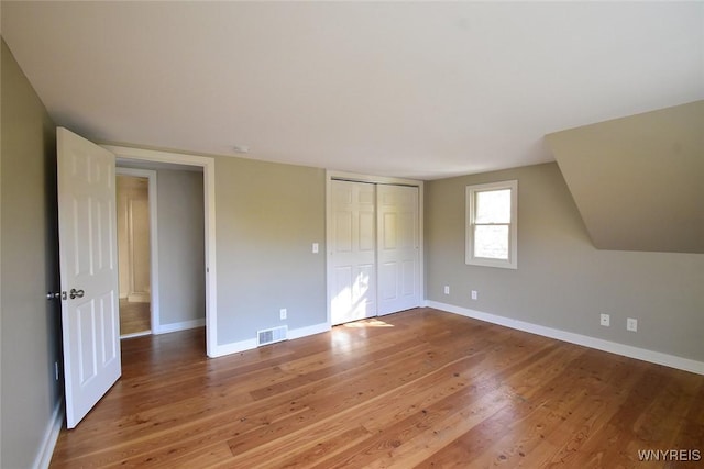 51 N Forest Rd, Amherst, NY 14221 - unfurnished bedroom featuring wood finished floors and a closet