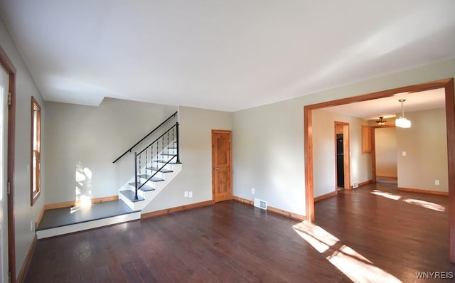 51 N Forest Rd, Amherst, NY 14221 - unfurnished living room with dark wood-style floors and stairs