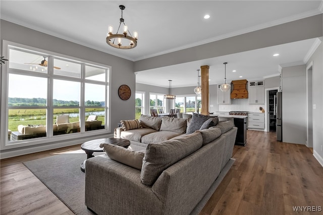 6993 Pine Lk, Pendleton, NY 14120 - living area featuring a chandelier, ornamental molding, recessed lighting, wood finished floors, and a water view