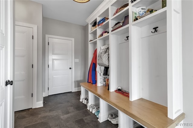 6993 Pine Lk, Pendleton, NY 14120 - mudroom with baseboards and stone finish floors