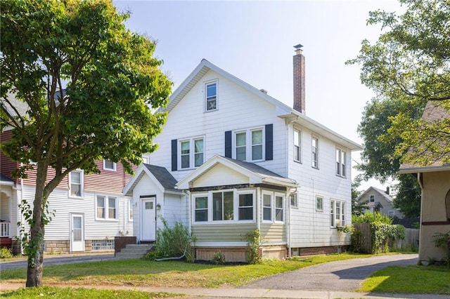 802 Merchants Rd, Rochester, NY 14609 - view of front of house featuring a chimney and entry steps