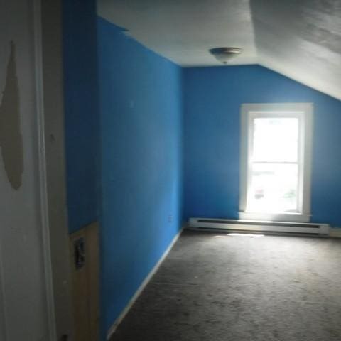 13 E Albion St, Murray, NY 14470 - bonus room featuring a baseboard radiator, vaulted ceiling, and carpet floors