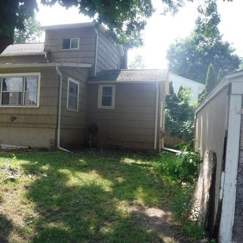 13 E Albion St, Murray, NY 14470 - view of side of property with a lawn and roof with shingles