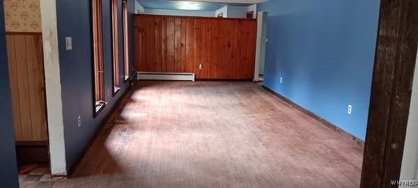 8567 Fairview Ter, Colden, NY 14033 - unfurnished room featuring a baseboard heating unit and carpet flooring