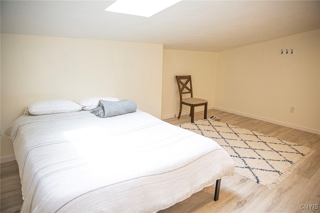 1346 Otisco Valley Rd, Otisco, NY 13110 - bedroom with light wood finished floors and a skylight