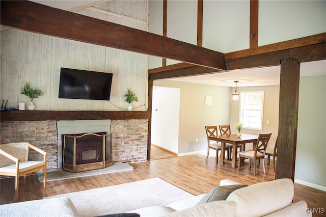 1346 Otisco Valley Rd, Otisco, NY 13110 - living area featuring a high ceiling, wood finished floors, and beamed ceiling