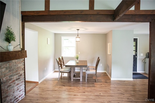 1346 Otisco Valley Rd, Otisco, NY 13110 - dining area featuring light wood-style flooring and beamed ceiling