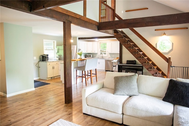 1346 Otisco Valley Rd, Otisco, NY 13110 - living room featuring light wood finished floors and stairs