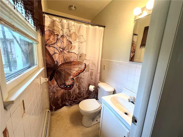 2 Maple Rd, Big Flats, NY 14845 - bathroom featuring tile walls, a baseboard heating unit, vanity, wainscoting, and curtained shower