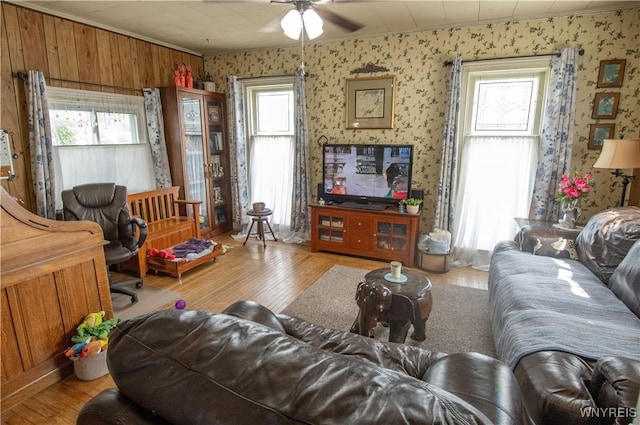 14 W Main St, Concord, NY 14141 - living area with wallpapered walls, wood-type flooring, a ceiling fan, and healthy amount of natural light