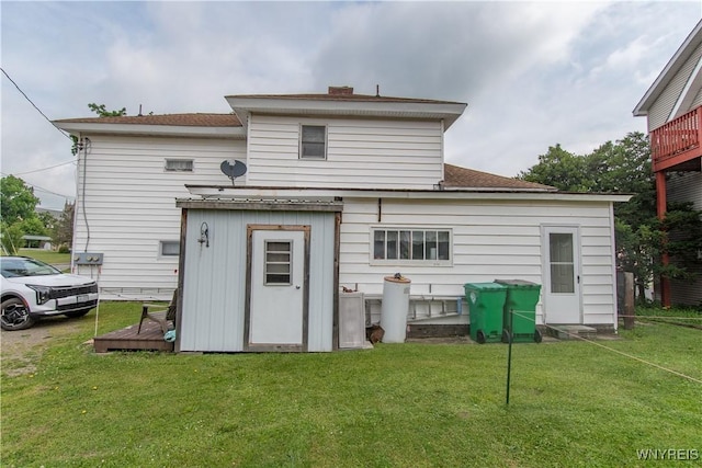 14 W Main St, Concord, NY 14141 - rear view of house featuring a yard, a chimney, and a shingled roof