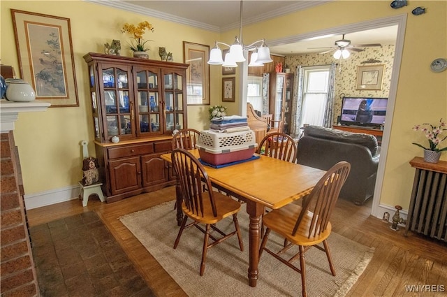 14 W Main St, Concord, NY 14141 - dining area featuring wood finished floors, ceiling fan, radiator, and crown molding