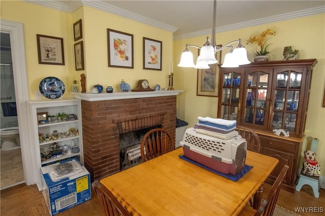 14 W Main St, Concord, NY 14141 - dining area featuring a chandelier, crown molding, wood finished floors, and a fireplace