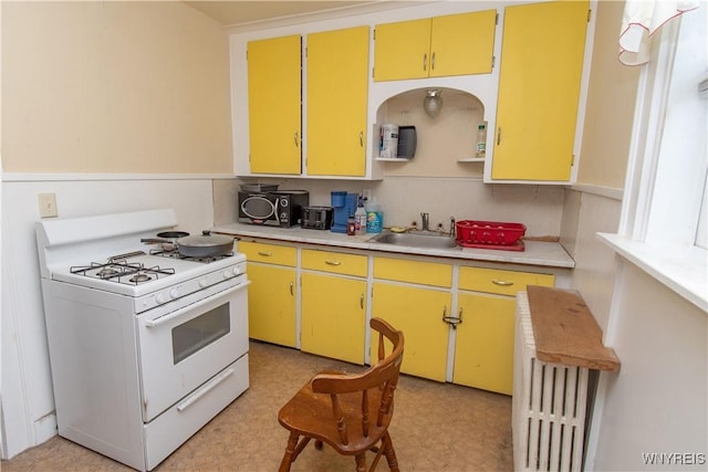 14 W Main St, Concord, NY 14141 - kitchen with white range with gas cooktop, light countertops, and light floors