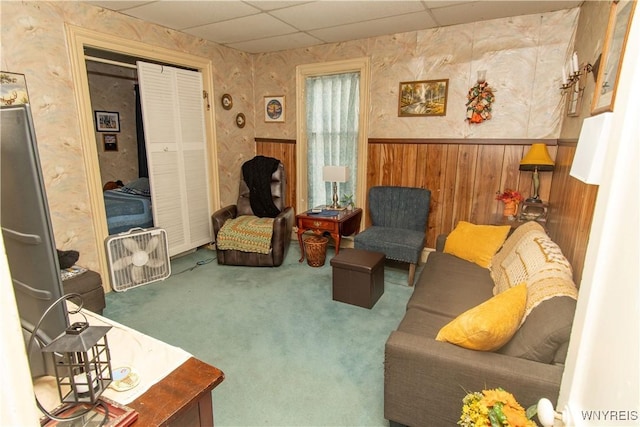 14 W Main St, Concord, NY 14141 - living area featuring a drop ceiling, carpet floors, a wainscoted wall, wallpapered walls, and wood walls