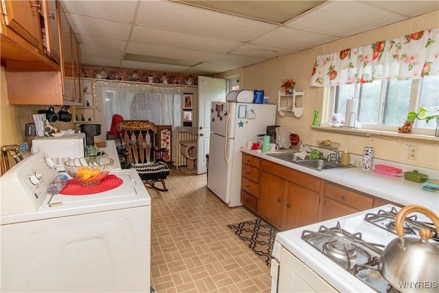 14 W Main St, Concord, NY 14141 - kitchen with washer / clothes dryer, a drop ceiling, white appliances, brick patterned floors, and light countertops