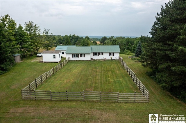 8800 Harmon Hill Rd, Pomfret, NY 14063 - view of front of home featuring a rural view, a metal roof, driveway, and a wooded view