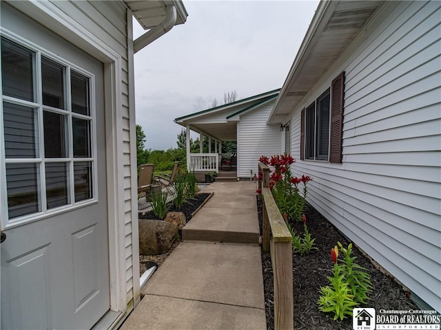 8800 Harmon Hill Rd, Pomfret, NY 14063 - view of side of home with a porch