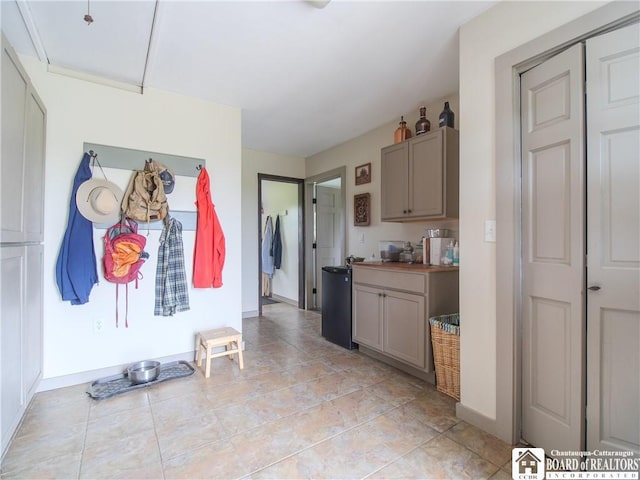8800 Harmon Hill Rd, Pomfret, NY 14063 - kitchen featuring gray cabinetry and baseboards