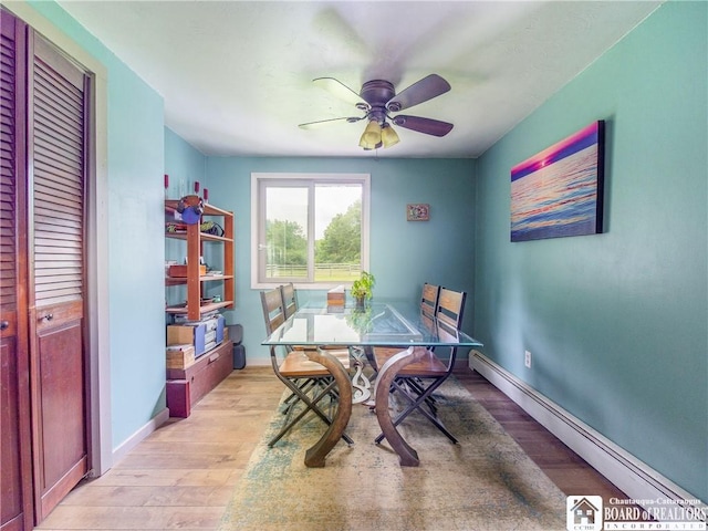 8800 Harmon Hill Rd, Pomfret, NY 14063 - dining space featuring a baseboard radiator, light wood finished floors, and a ceiling fan