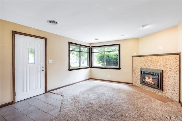 26 Farber Ln, Amherst, NY 14221 - carpeted foyer entrance with a tile fireplace and baseboards