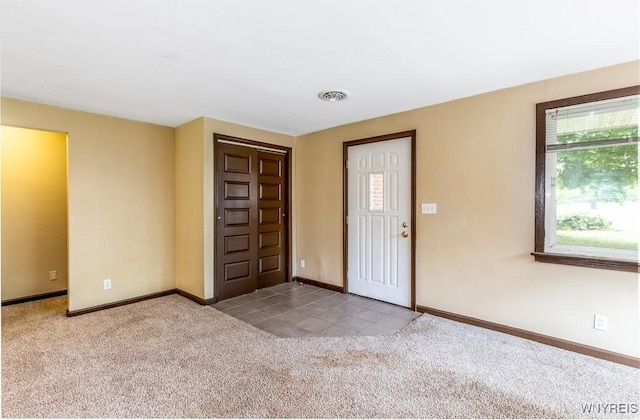 26 Farber Ln, Amherst, NY 14221 - carpeted entryway with baseboards