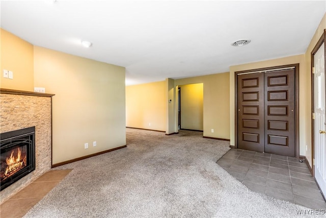 26 Farber Ln, Amherst, NY 14221 - unfurnished living room with a fireplace with flush hearth and carpet flooring