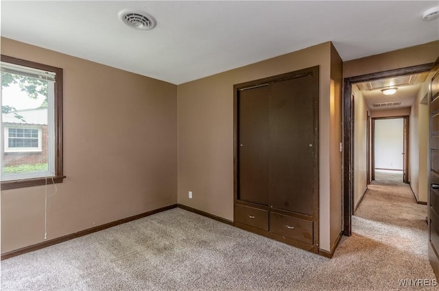 26 Farber Ln, Amherst, NY 14221 - unfurnished bedroom with light colored carpet and attic access