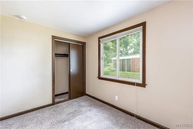 26 Farber Ln, Amherst, NY 14221 - unfurnished bedroom with a closet and light carpet