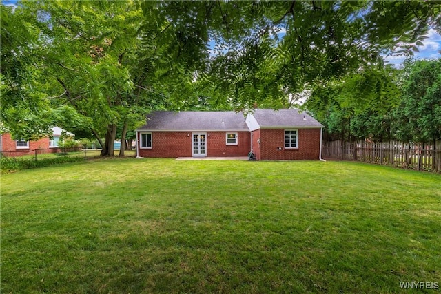 26 Farber Ln, Amherst, NY 14221 - rear view of property with a fenced backyard and brick siding