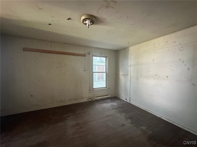 85 W Clark St, German Flatts, NY 13357 - empty room featuring dark wood finished floors and baseboard heating