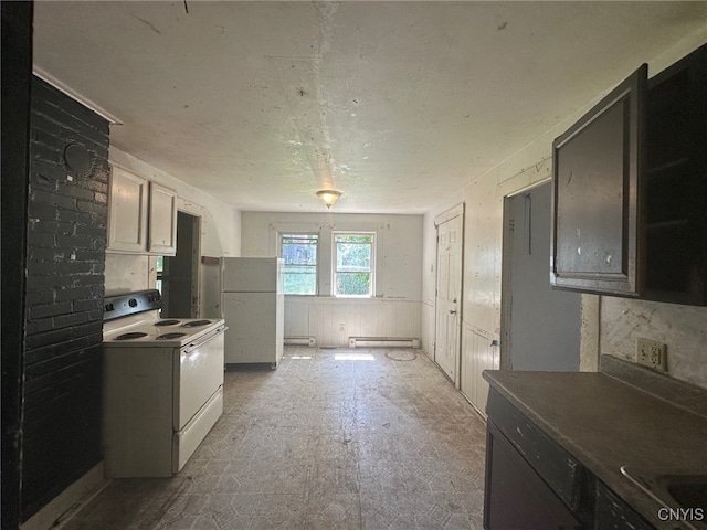 85 W Clark St, German Flatts, NY 13357 - kitchen featuring white appliances and baseboard heating