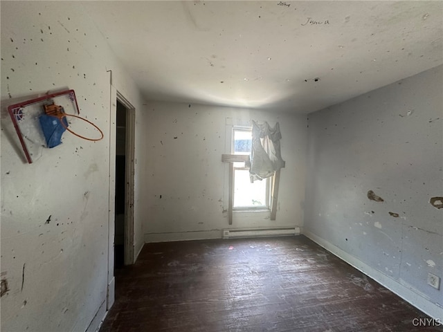 85 W Clark St, German Flatts, NY 13357 - spare room featuring a baseboard heating unit and wood finished floors