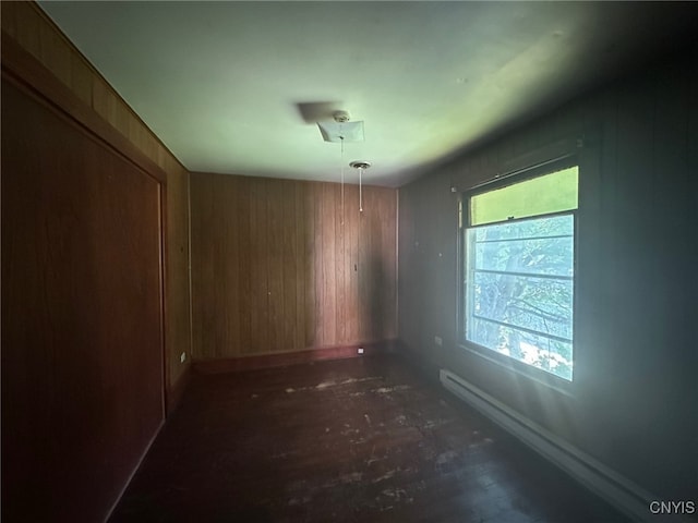 85 W Clark St, German Flatts, NY 13357 - empty room featuring baseboards and wooden walls