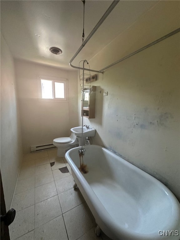 85 W Clark St, German Flatts, NY 13357 - bathroom with baseboard heating, bathing tub / shower combination, and tile patterned flooring