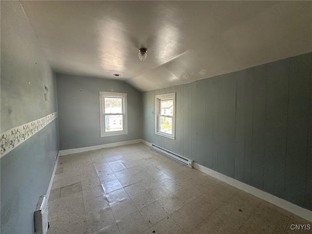 85 W Clark St, German Flatts, NY 13357 - unfurnished room featuring a baseboard heating unit, lofted ceiling, and tile patterned floors