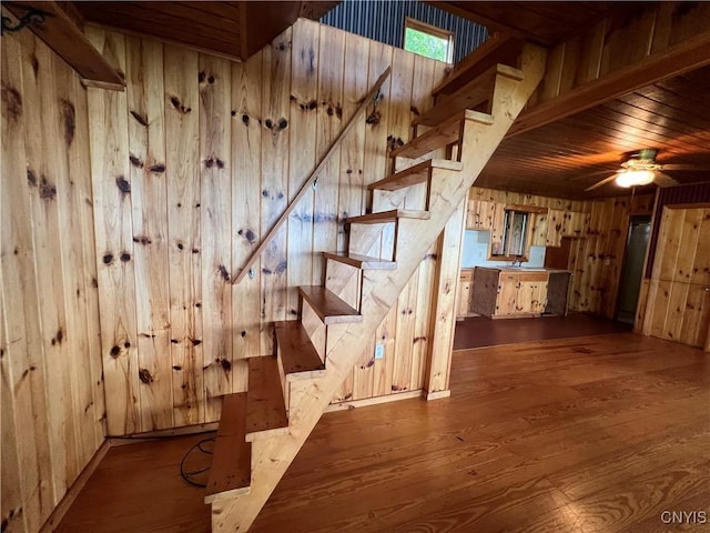 8227 Catfish Point Rd, Cape Vincent, NY 13624 - stairs featuring wooden walls, wood finished floors, wood ceiling, and a ceiling fan