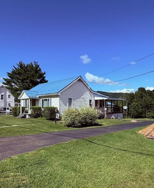 6113 Rte 46, Keating Town, PA 16749 - view of home's exterior featuring a lawn and a metal roof