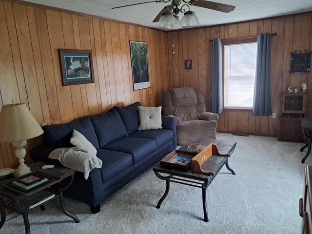 6113 Rte 46, Keating Town, PA 16749 - living room with carpet flooring, a ceiling fan, and wood walls