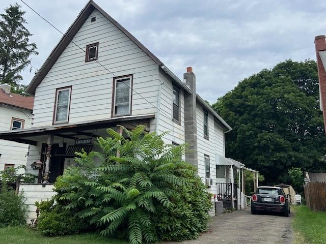 67 Perry Ave, Corning City, NY 14830 - view of front of house with a chimney