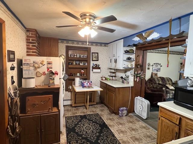 67 Perry Ave, Corning City, NY 14830 - kitchen with wallpapered walls, a ceiling fan, open shelves, light countertops, and black microwave