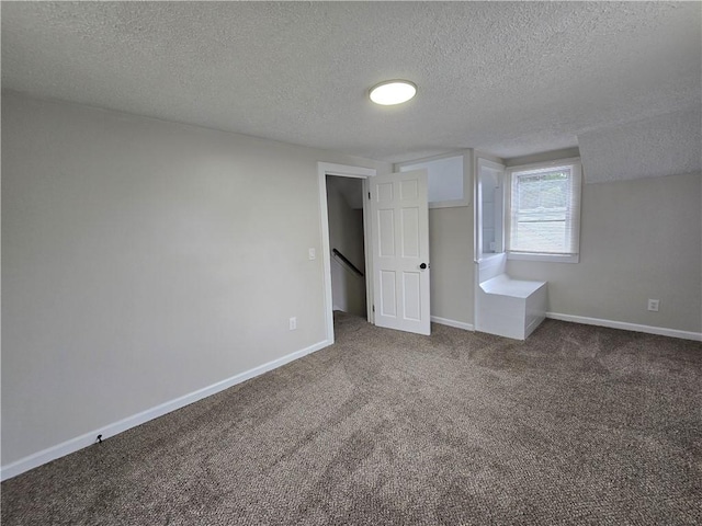 2381 Culver Rd, Irondequoit, NY 14609 - unfurnished bedroom with a textured ceiling and carpet