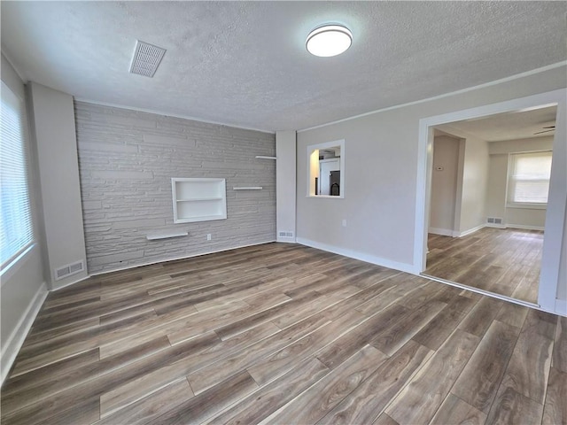 2381 Culver Rd, Irondequoit, NY 14609 - unfurnished room with a textured ceiling and wood finished floors