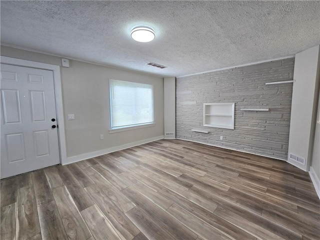 2381 Culver Rd, Irondequoit, NY 14609 - unfurnished living room featuring wood finished floors and a textured ceiling